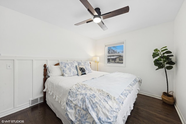 bedroom featuring dark hardwood / wood-style floors and ceiling fan