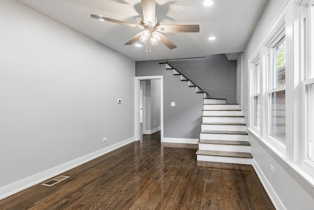 interior space with ceiling fan and hardwood / wood-style floors