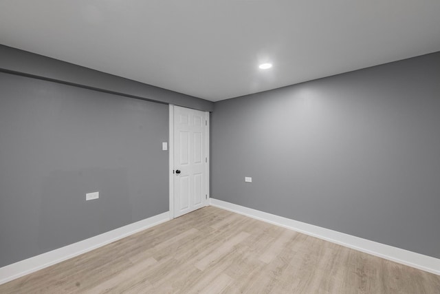 empty room with light hardwood / wood-style flooring