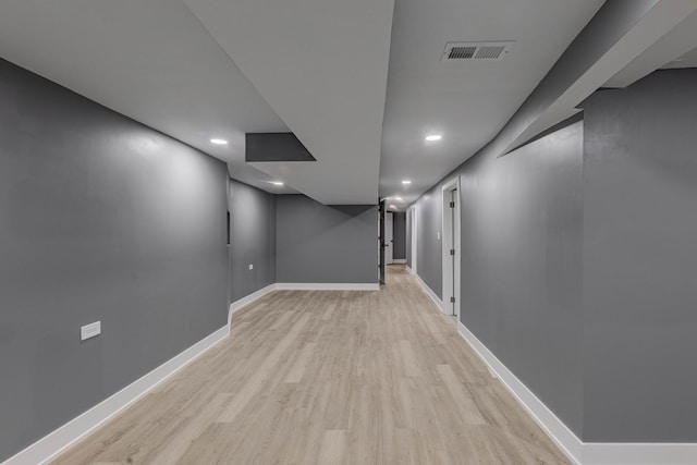 basement with light wood-type flooring