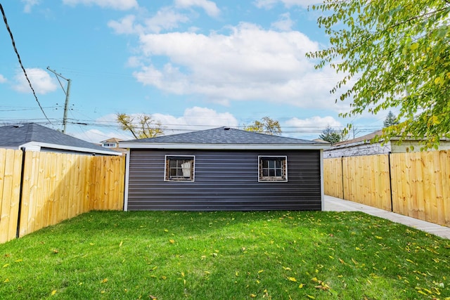 view of outbuilding with a lawn