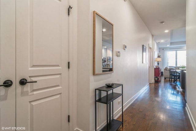 hall with dark hardwood / wood-style flooring