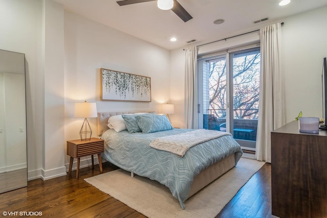 bedroom featuring dark hardwood / wood-style floors, access to outside, and ceiling fan