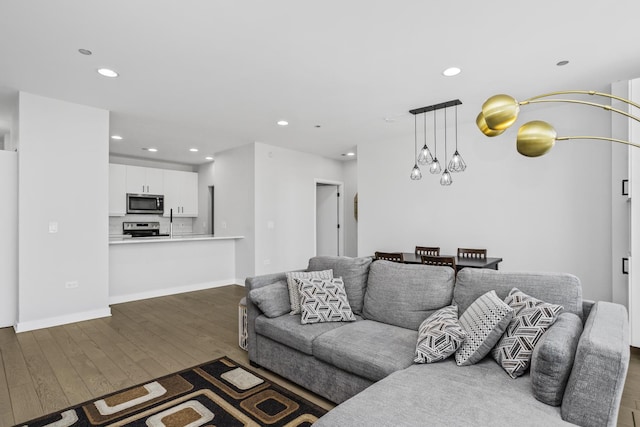 living room with dark hardwood / wood-style flooring