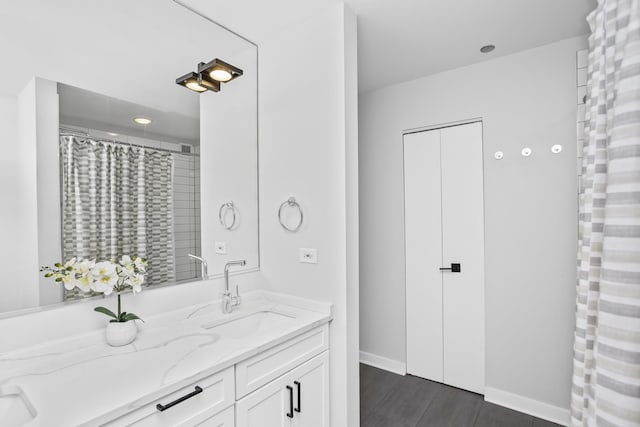 bathroom featuring vanity and hardwood / wood-style floors