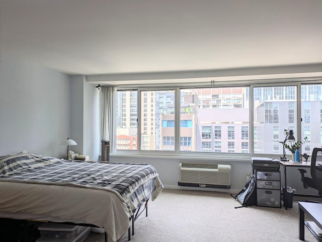 bedroom with light carpet, multiple windows, and a wall mounted air conditioner