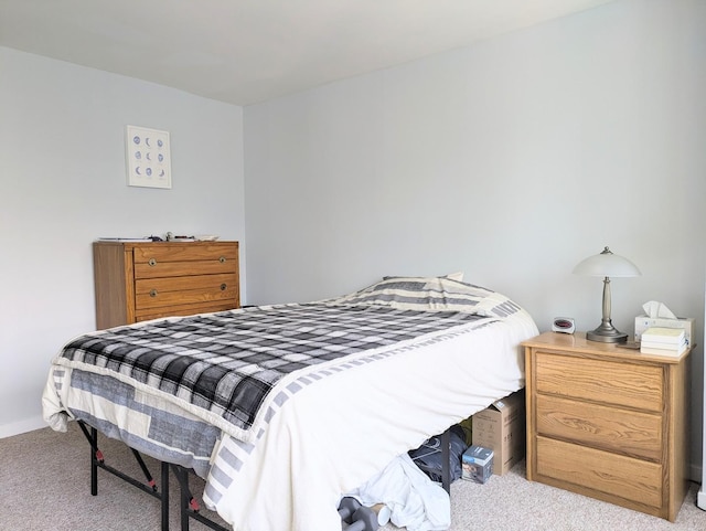 bedroom featuring light carpet