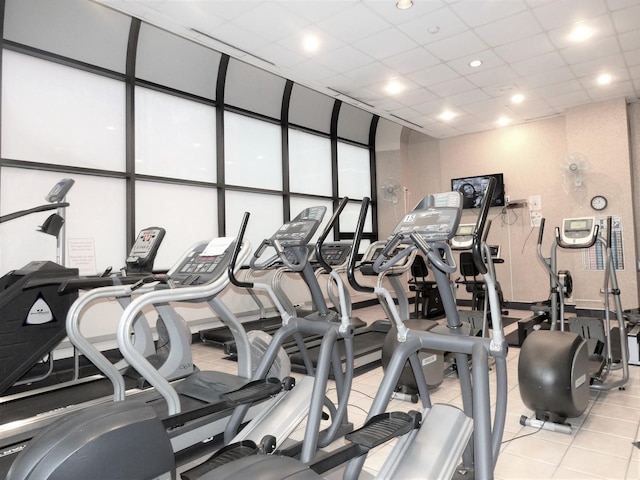 exercise room featuring a drop ceiling