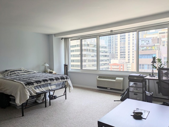 bedroom featuring light colored carpet and a wall mounted air conditioner