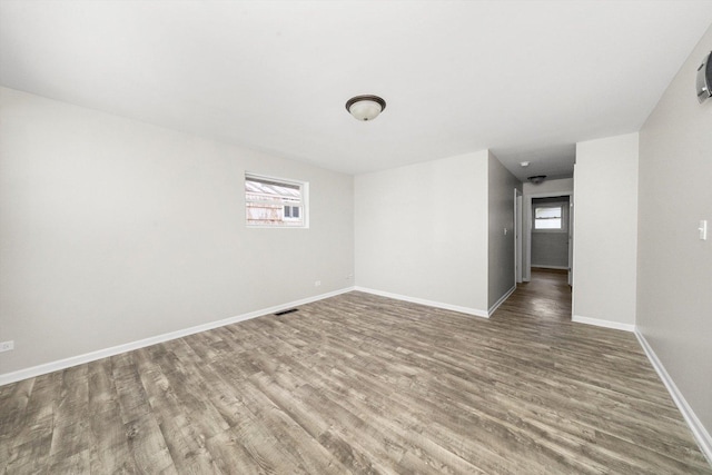 empty room with wood-type flooring