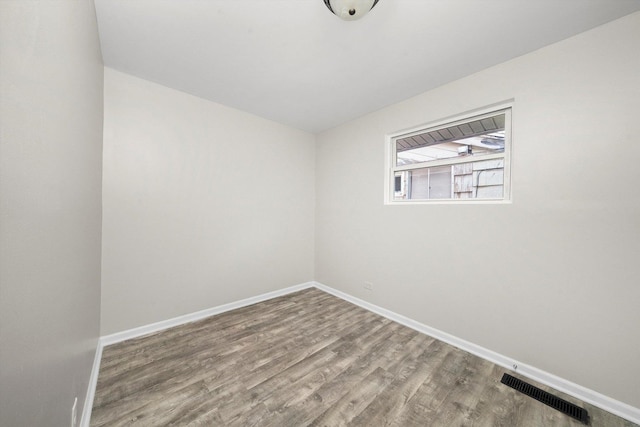 unfurnished room featuring hardwood / wood-style floors