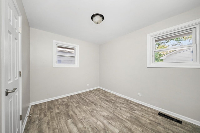 unfurnished room featuring wood-type flooring