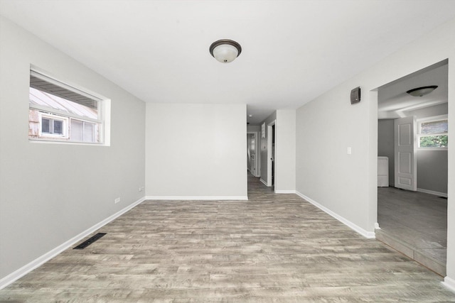 unfurnished room with light hardwood / wood-style flooring