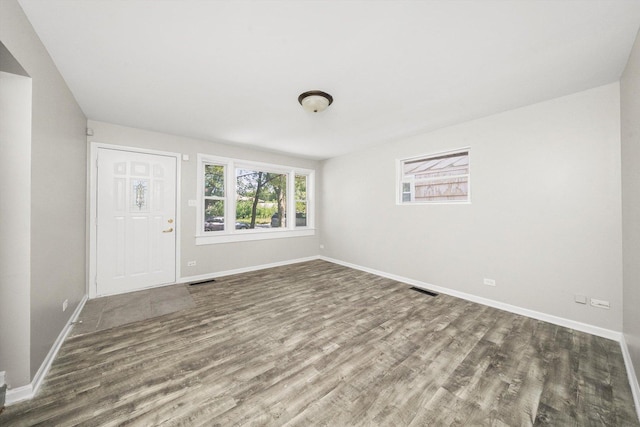 spare room with dark hardwood / wood-style floors