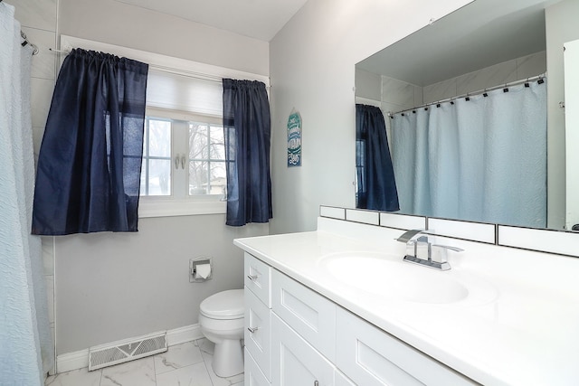 bathroom featuring toilet and vanity