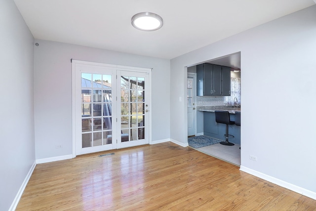 interior space featuring sink and light hardwood / wood-style floors