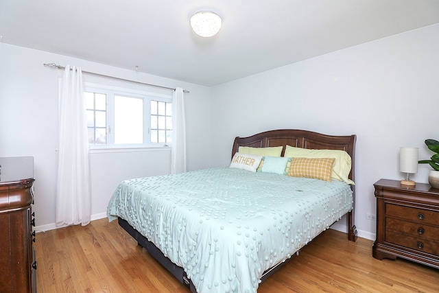 bedroom with light wood-type flooring