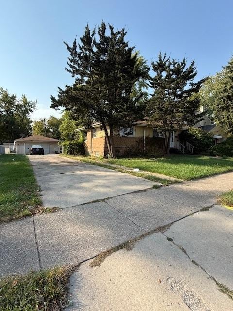 view of front of house with a garage and a front yard