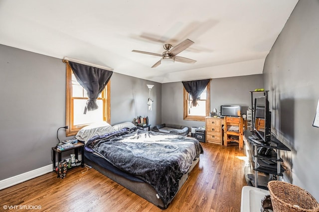 bedroom with ceiling fan and wood-type flooring