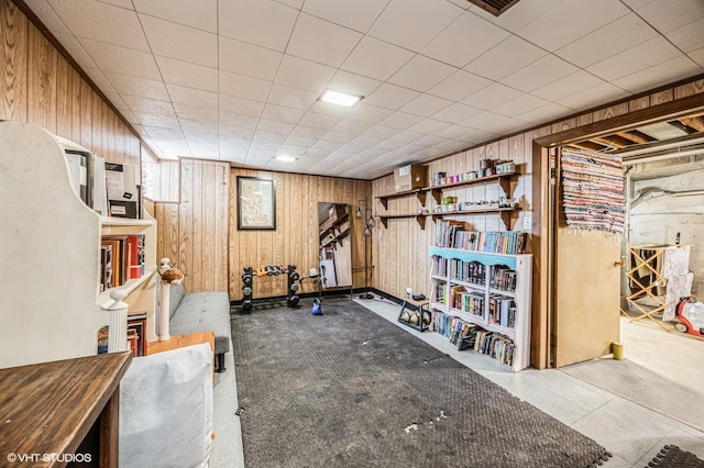 workout area featuring wood walls