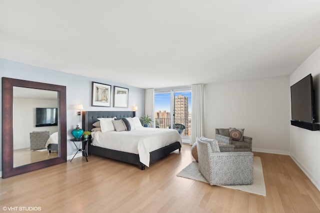 bedroom with light wood-type flooring