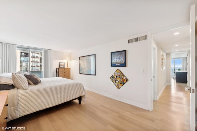 bedroom with light hardwood / wood-style floors