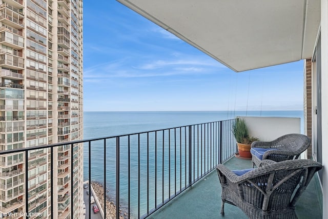 balcony featuring a water view