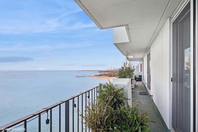 balcony featuring a water view