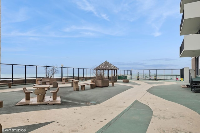 view of community with a water view and a gazebo