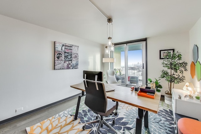 office area with hardwood / wood-style floors