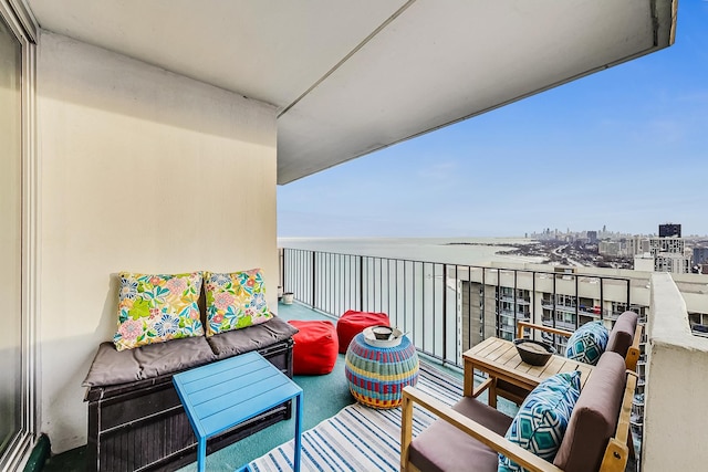 balcony featuring a water view