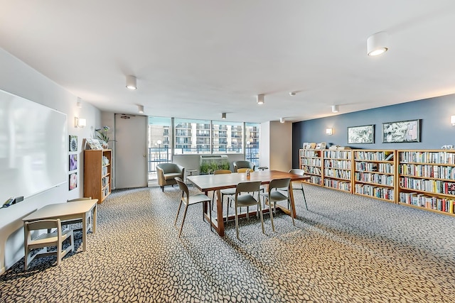 dining space featuring floor to ceiling windows