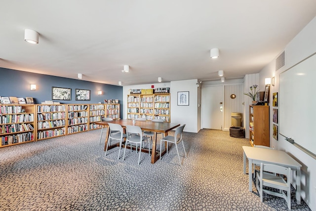 dining room featuring carpet flooring