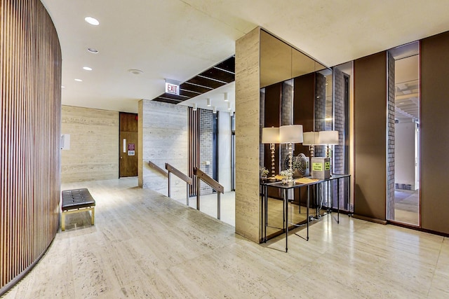 hallway featuring expansive windows