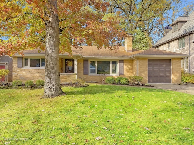 view of front of property with a garage and a front yard