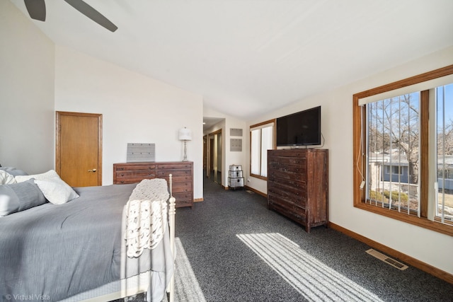 bedroom featuring ceiling fan, visible vents, baseboards, vaulted ceiling, and dark carpet