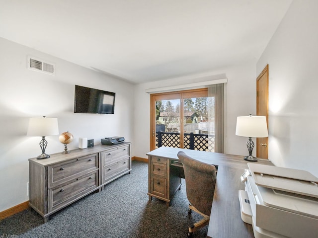 office area with dark carpet, visible vents, and baseboards