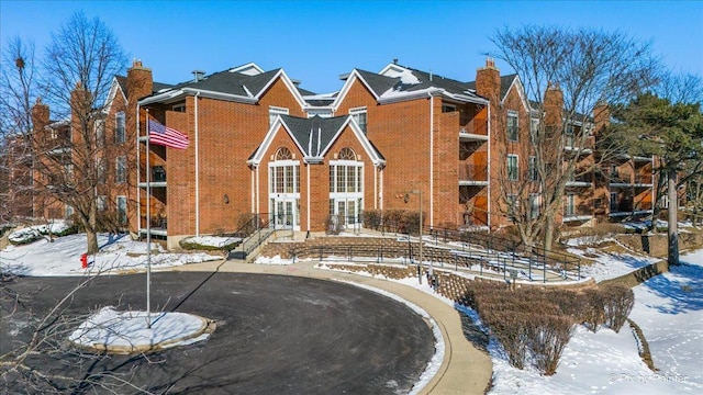 traditional-style house featuring brick siding