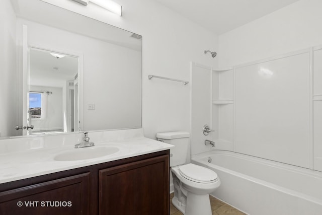 full bathroom with washtub / shower combination, vanity, and toilet