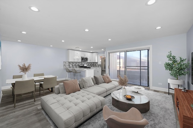 living room with light hardwood / wood-style flooring