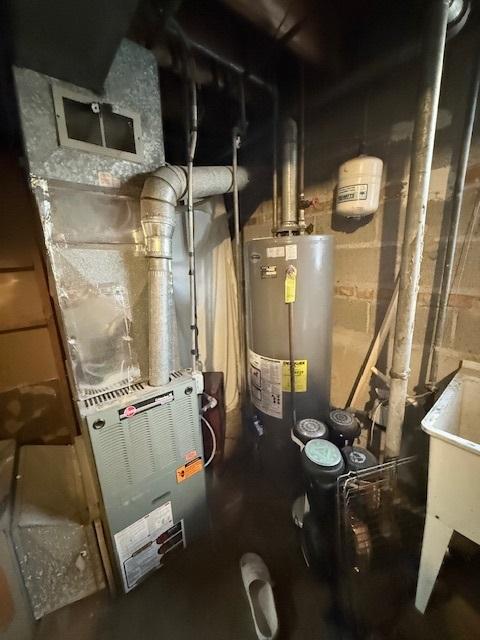 utility room with water heater