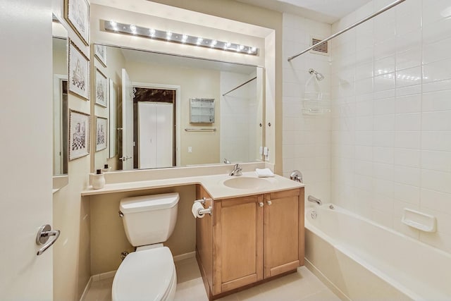 full bathroom featuring vanity, toilet, tile patterned flooring, and tiled shower / bath combo