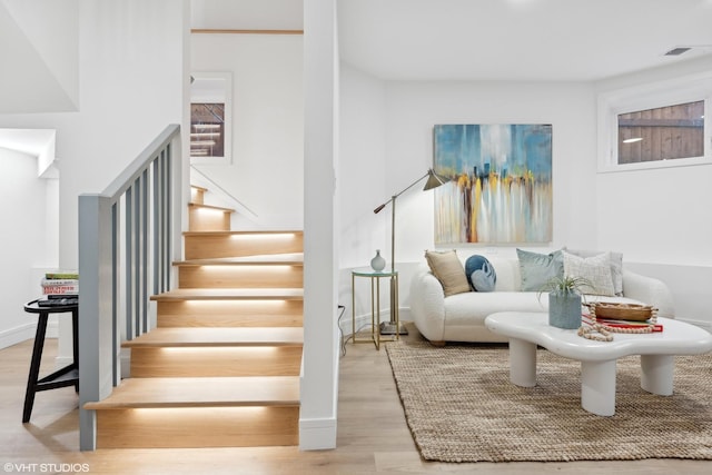 stairs with hardwood / wood-style flooring