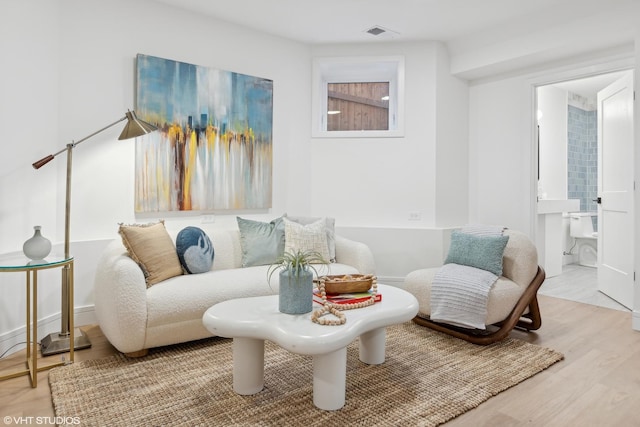 sitting room featuring light wood-type flooring