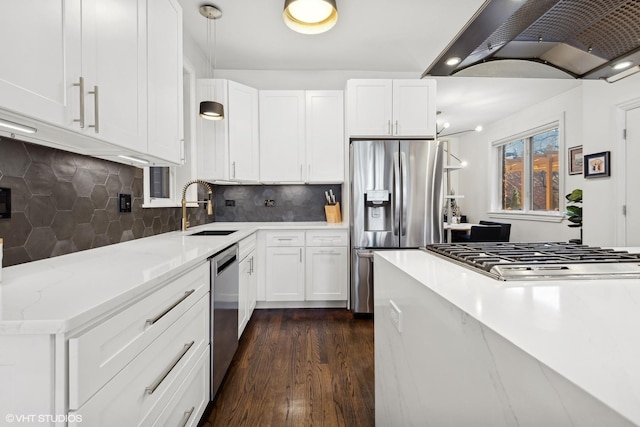 kitchen featuring white cabinetry, extractor fan, appliances with stainless steel finishes, and sink