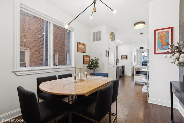 dining area featuring dark hardwood / wood-style flooring