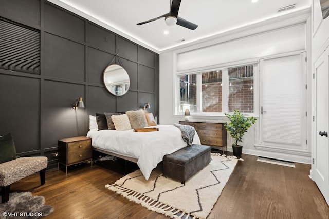 bedroom featuring ceiling fan and dark hardwood / wood-style flooring