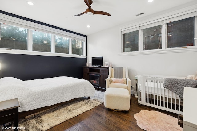 bedroom with wood-type flooring and ceiling fan