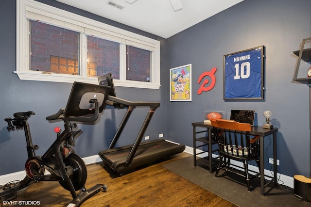 workout area with dark wood-type flooring