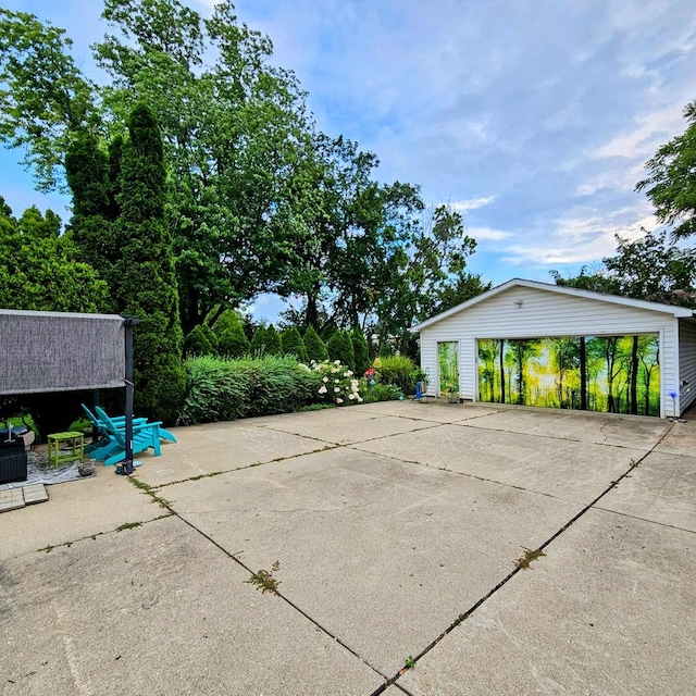 view of patio / terrace with an outbuilding